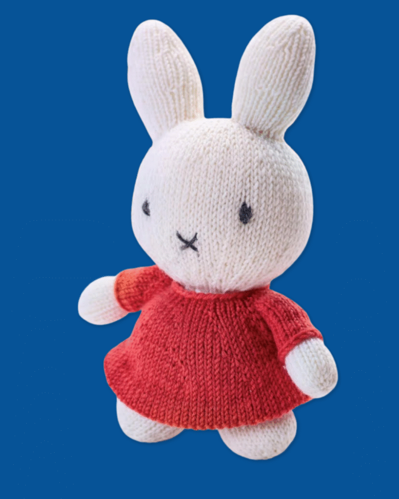 knitted Miffy toy, miffy the rabbit wearing a red dress, knitting pattern by jane burns