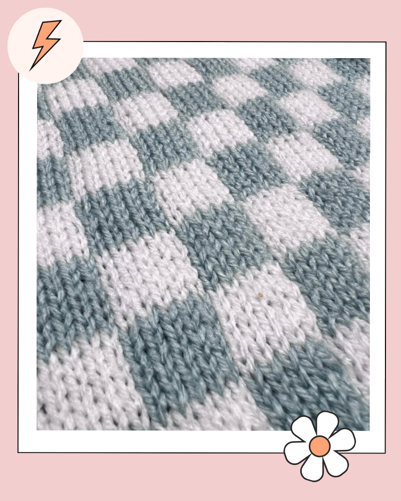 smooth blocked white and blue check knit fabric showing the finished piece after blocking