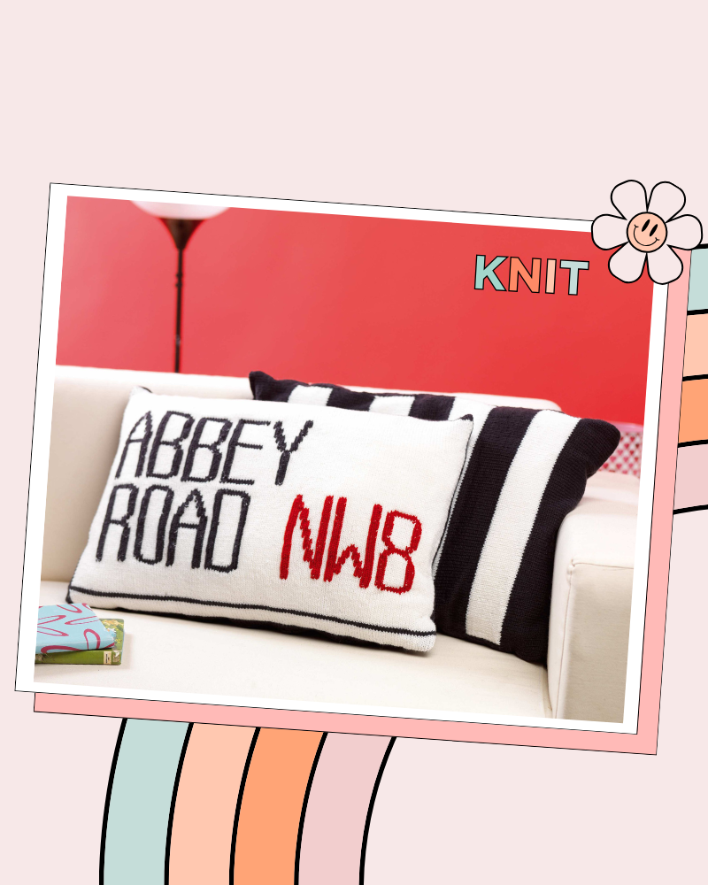Free Beatles Abbey Road Cushion Knitting Pattern Two knitted cushion covers on a white sofa — Abbey Road NW8 street sign cushion in black, white and red, alongside a black and white striped zebra crossing cushion, knitting pattern by Jane Burns