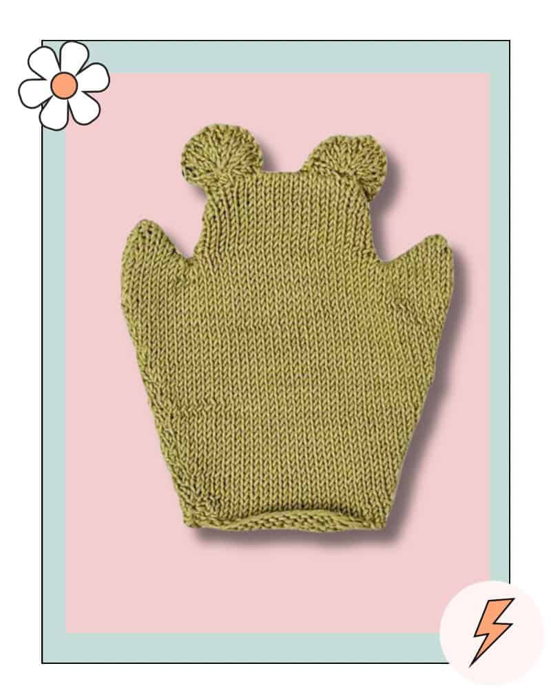 Knitted frog bath mitt with round stuffed eyes, free baby bath mitt knitting pattern in sage green DK cotton