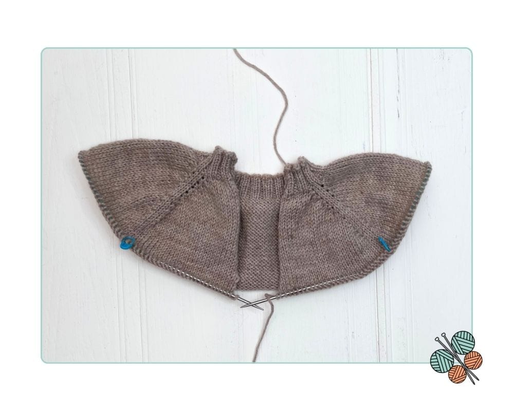 Image shows, raglan increases complete on a top-down seamless cardigan for children, yoke at full depth before separation how-to-knit-a-top-down-cardigan-for-kids