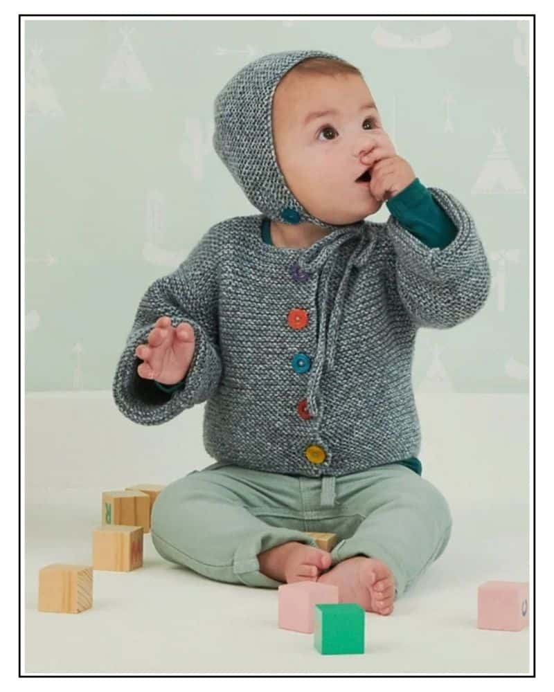 Baby wearing a free garter stitch baby bonnet knitting pattern, photo in a decorative frame