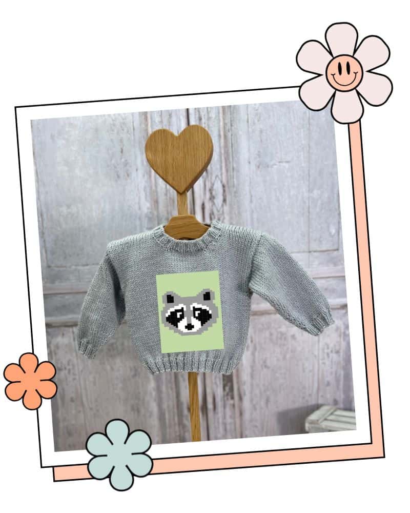 Raccoon jumper knitted for a baby, Bandit motif on the Blank Canvas Baby Sweater in Meadow green