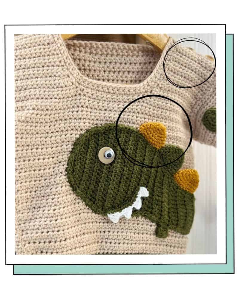 close-up of the real crochet dinosaur jumper showing clear spots, spikes and buttons