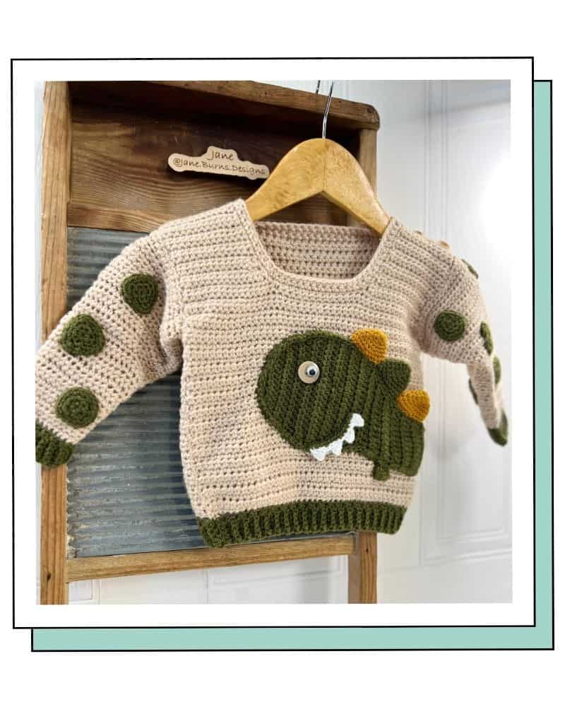 genuine crochet dinosaur jumper by Jane Burns, used to show how to spot AI knitting patterns and crochet fakes
