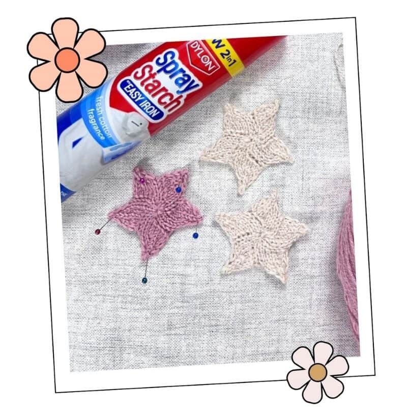 step 6 of the knitted christmas star pattern, star pinned out on a blocking board with spray starch