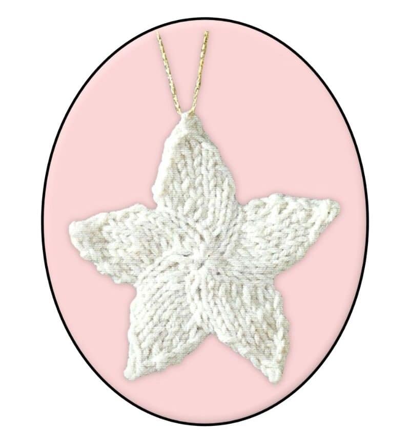 finished cream knitted christmas star with a gold thread hanging loop