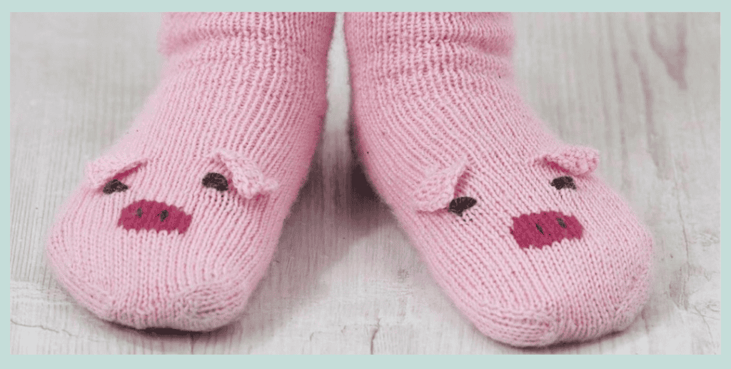 Free Pig Socks Knitting Pattern for Kids front view worn Jane Burns knitting pattern, Piggy socks for the family